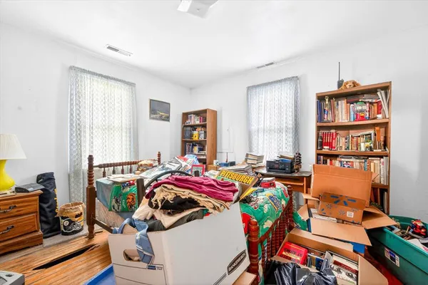 a bedroom with furniture and a window