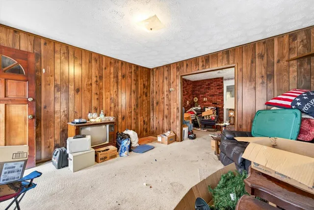 a bed room with a bed and a chair