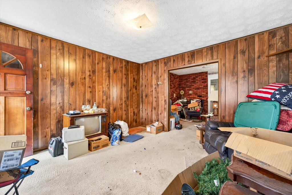 413 Commerce Avenue Iron Gate, VA 24422 - Photo 4 of 18 a bed room with a bed and a chair