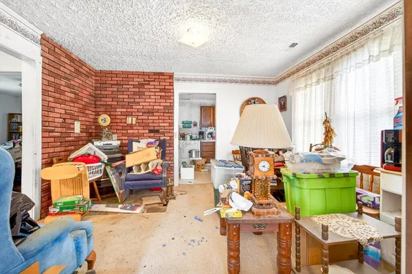 a living room filled with furniture windows and a table