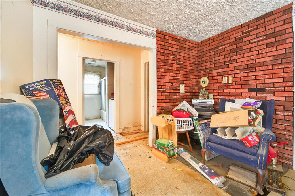 413 Commerce Avenue Iron Gate, VA 24422 - Photo 7 of 18 a room with furniture and a wooden floor