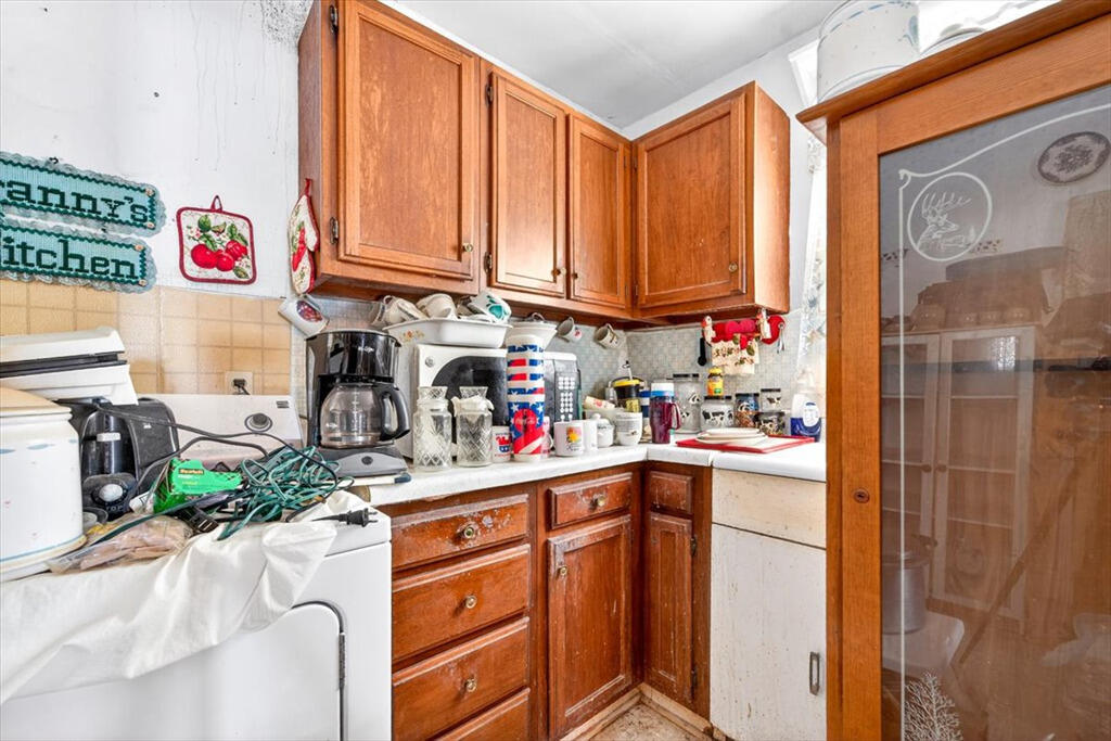 413 Commerce Avenue Iron Gate, VA 24422 - Photo 9 of 18 a kitchen with stainless steel appliances granite countertop a sink and cabinets