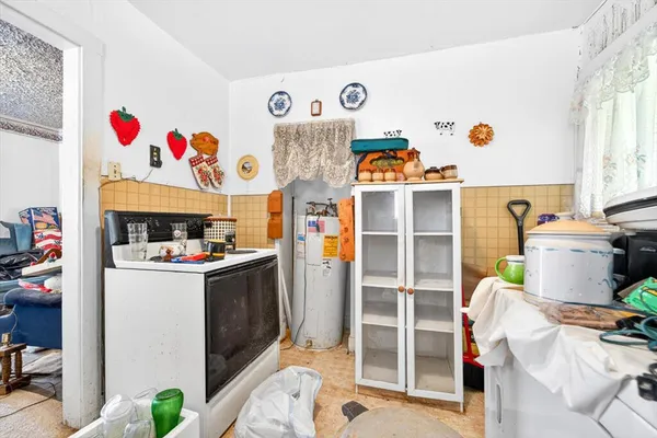 a kitchen with a refrigerator and a window