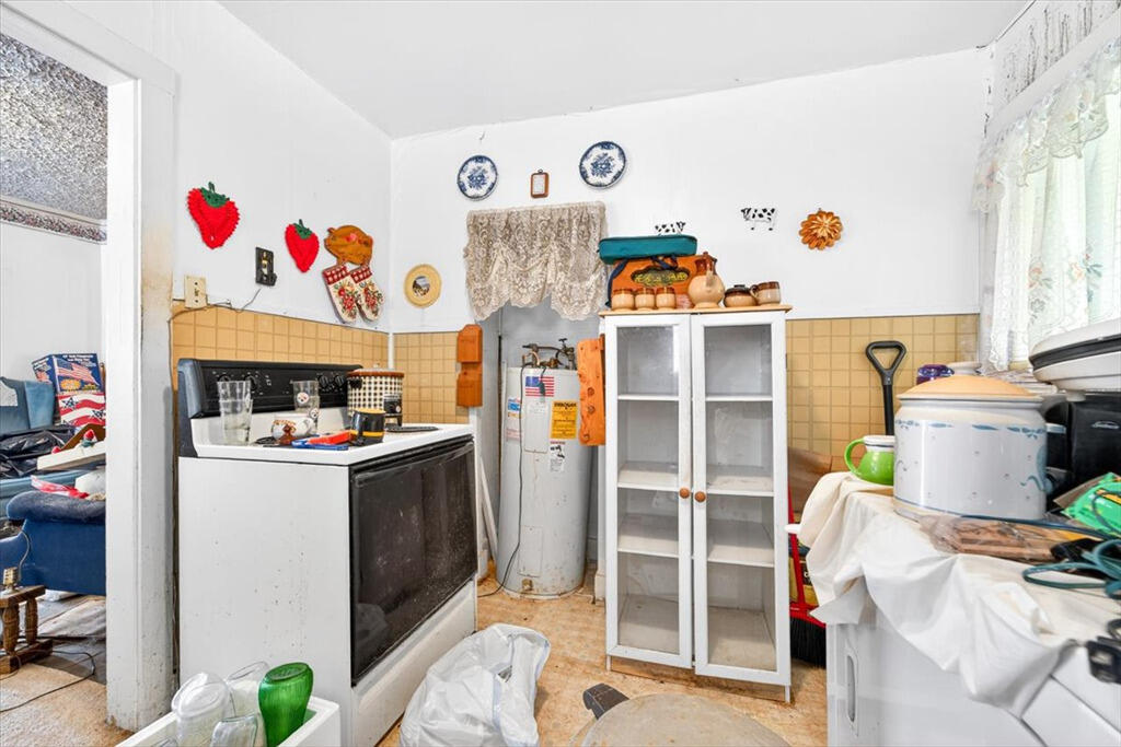 413 Commerce Avenue Iron Gate, VA 24422 - Photo 10 of 18 a kitchen with a refrigerator and a window