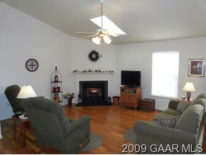 204 Rutledge Drive Waynesboro, VA 22980 - Photo 3 of 11 a living room with furniture a fireplace and a flat screen tv