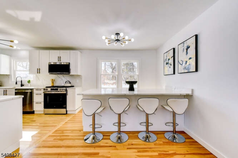 22 Glen Road Bridgewater, NJ 08805 - Photo 20 of 48 a living room with furniture and a flat screen tv