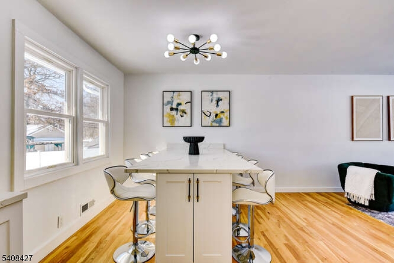 22 Glen Road Bridgewater, NJ 08805 - Photo 22 of 48 a bedroom with a bed and a chandelier