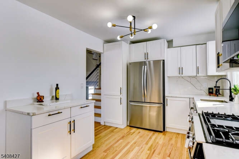 22 Glen Road Bridgewater, NJ 08805 - Photo 26 of 48 a kitchen with stainless steel appliances a refrigerator and a stove top oven
