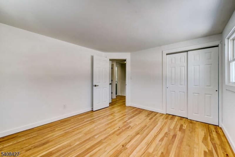 22 Glen Road Bridgewater, NJ 08805 - Photo 37 of 48 a view of empty room with wooden floor