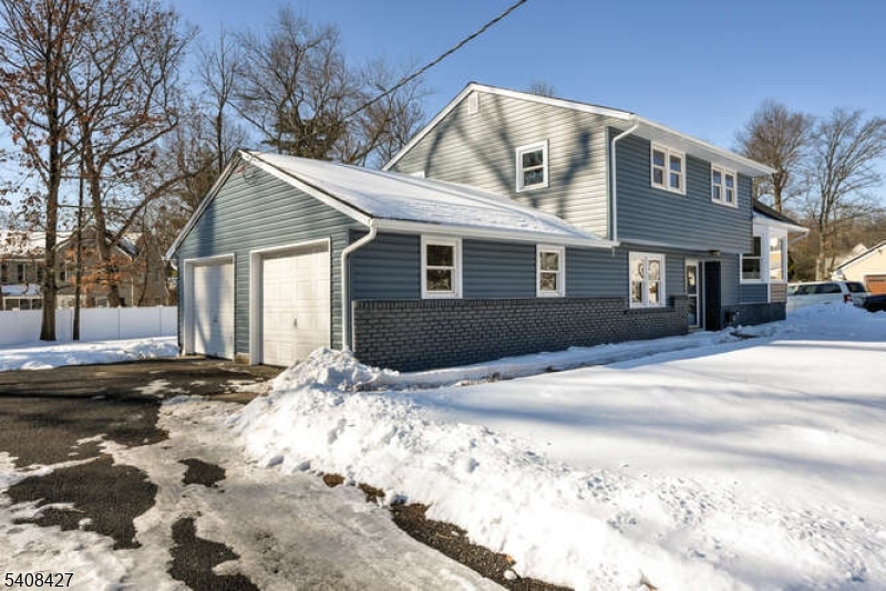 22 Glen Road Bridgewater, NJ 08805 - Photo 47 of 48 a front view of a house with a snow on the road