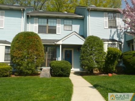803 Maplecrest Road Edison, NJ 08820 - Photo 1 of 6 a front view of a house with garden