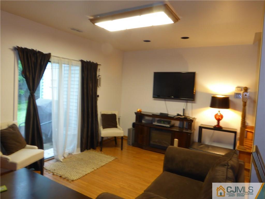803 Maplecrest Road Edison, NJ 08820 - Photo 2 of 6 a view of a livingroom with workspace and a couch