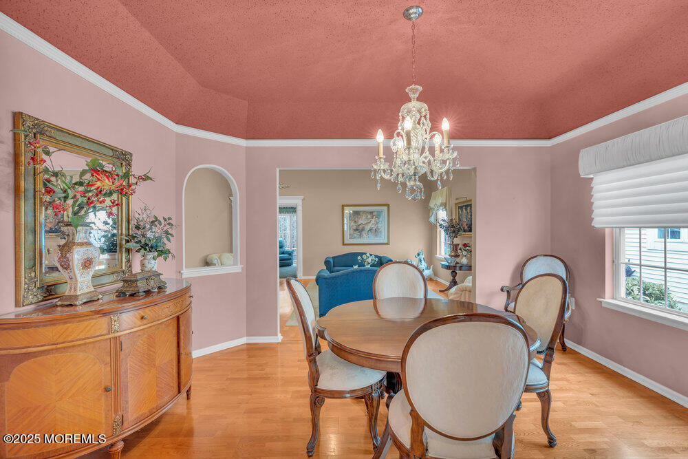 93 Pebble Beach Boulevard Jackson, NJ 08527 - Photo 11 of 47 a dining room with furniture a chandelier and window