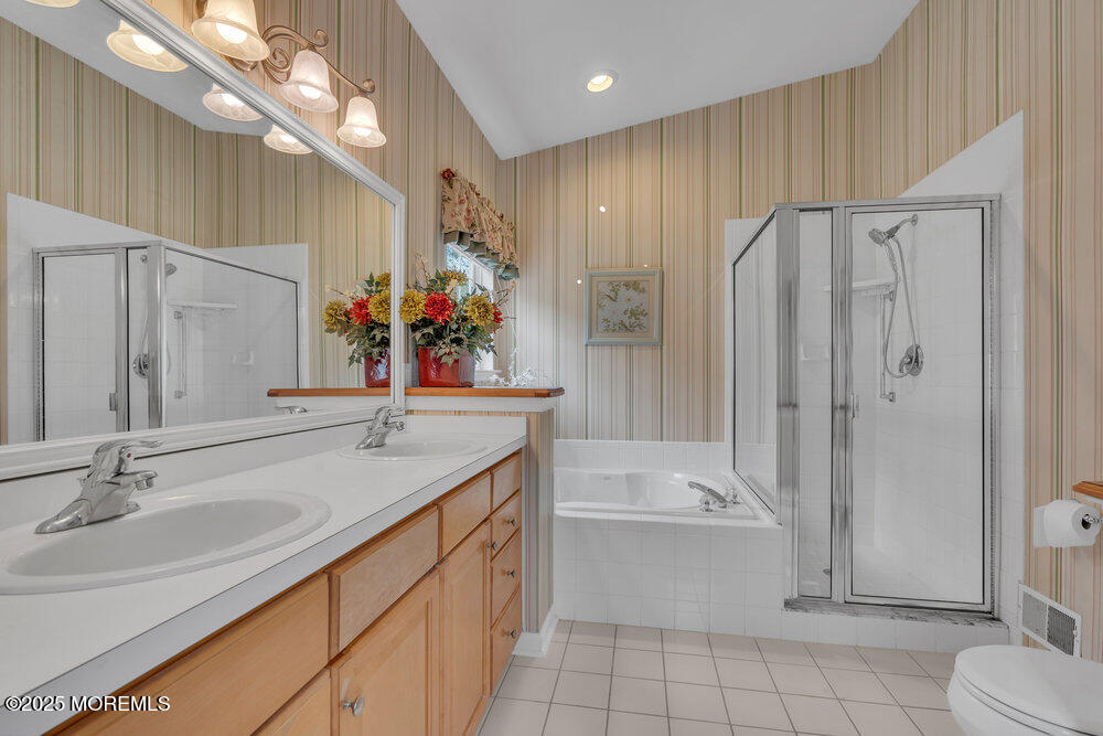 93 Pebble Beach Boulevard Jackson, NJ 08527 - Photo 20 of 47 a bathroom with a granite countertop sink a toilet and shower