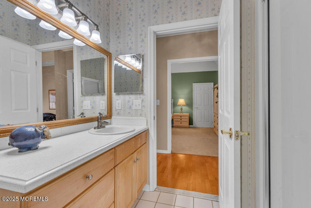 93 Pebble Beach Boulevard Jackson, NJ 08527 - Photo 22 of 47 a bathroom with a sink and a mirror