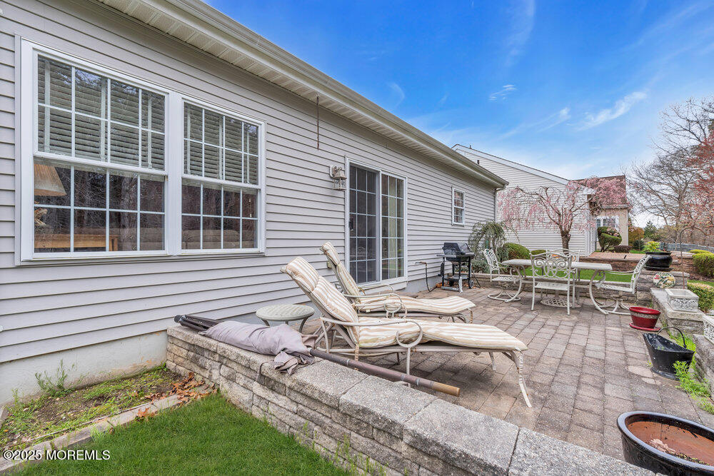 93 Pebble Beach Boulevard Jackson, NJ 08527 - Photo 26 of 47 a view of a lounge chairs in the back yard