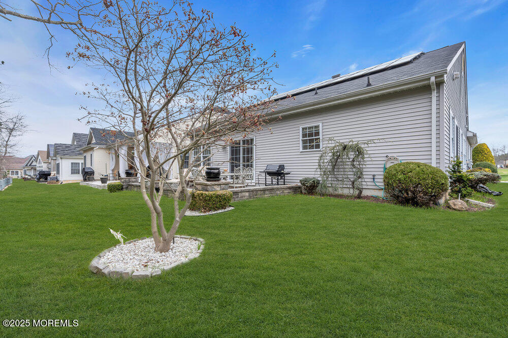 93 Pebble Beach Boulevard Jackson, NJ 08527 - Photo 28 of 47 a front view of a house with a garden