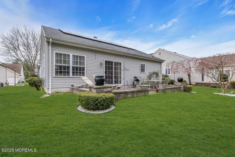 93 Pebble Beach Boulevard Jackson, NJ 08527 - Photo 30 of 47 a front view of house with yard and outdoor seating