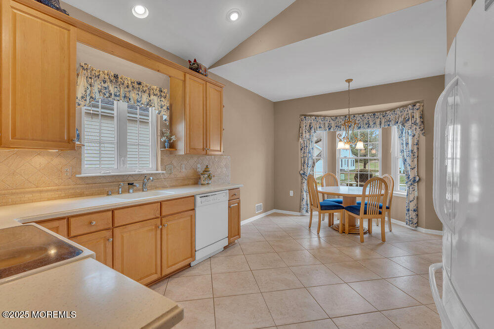 93 Pebble Beach Boulevard Jackson, NJ 08527 - Photo 7 of 47 a large white kitchen with a large window