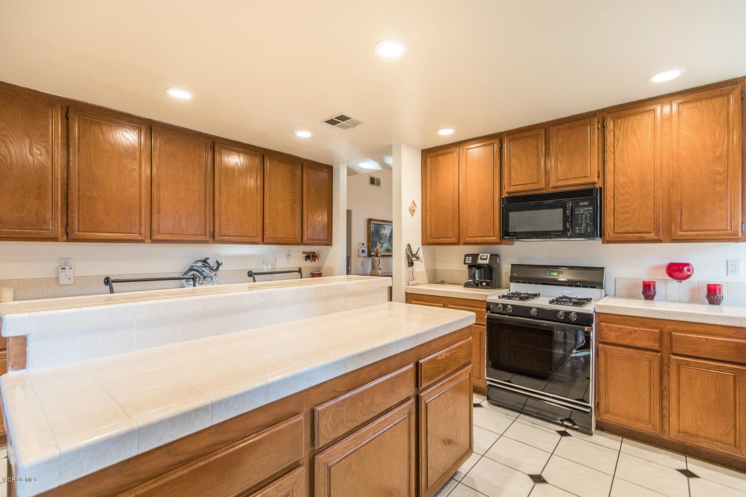 2073 Old Ranch Road Camarillo, CA 93012 - Photo 18 of 47 a kitchen with stainless steel appliances granite countertop a sink stove and microwave