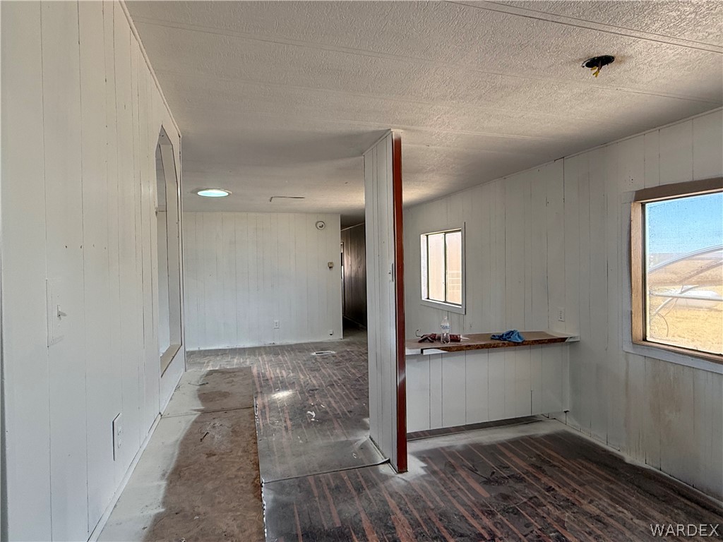 8051 7th Street Dolan Springs, AZ 86441 - Photo 22 of 65 an empty room with wooden floor and windows