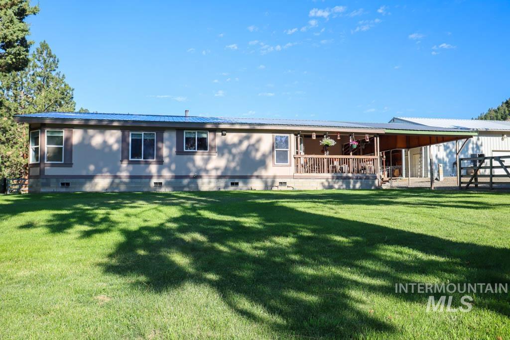 32290 Rice Road Unity, OR 97884 - Photo 36 of 45 Rear view of house with crawl space and a metal roof