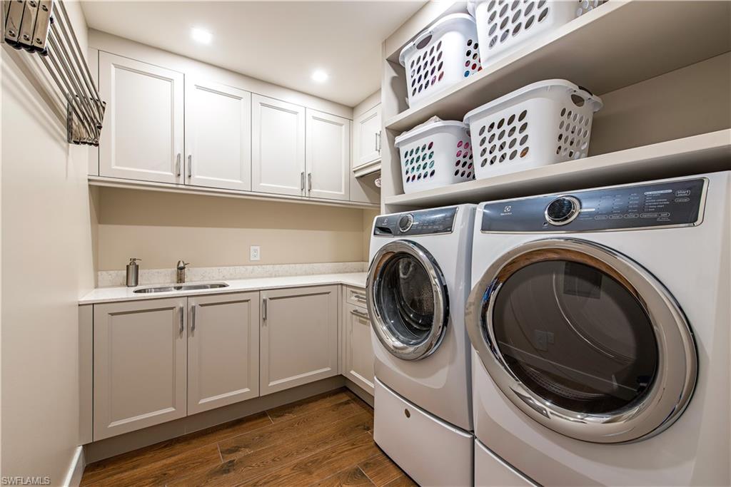 13915 Old Coast Road, Unit 602 Naples, FL 34110 - Photo 11 of 25 a utility room with sink dryer and washer