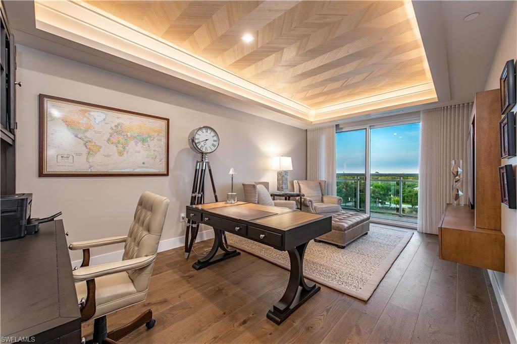 13915 Old Coast Road, Unit 602 Naples, FL 34110 - Photo 13 of 25 a view of a workspace with furniture window and wooden floor