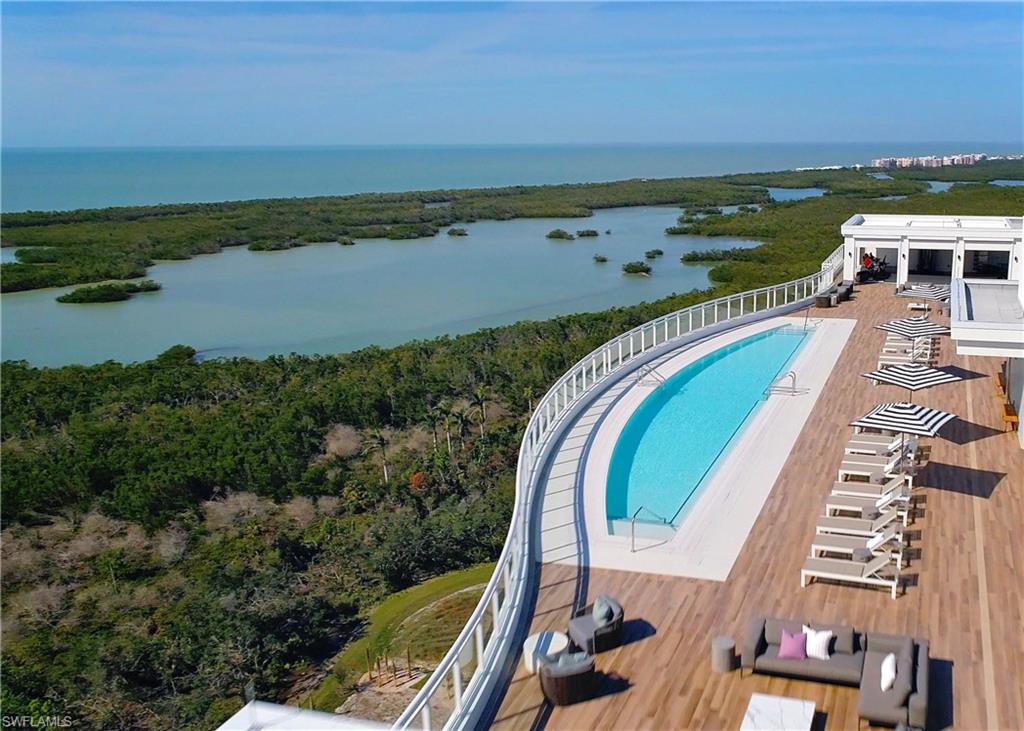 13915 Old Coast Road, Unit 602 Naples, FL 34110 - Photo 21 of 25 an aerial view of a residential houses with outdoor space and ocean view