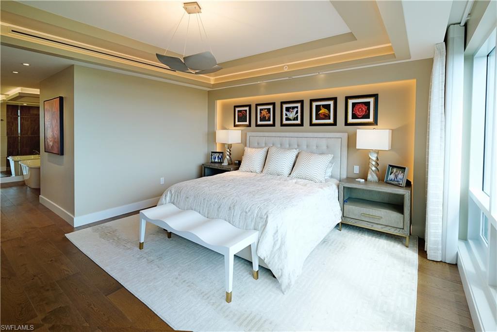 13915 Old Coast Road, Unit 602 Naples, FL 34110 - Photo 10 of 25 a bedroom with a bed and a view of bathroom