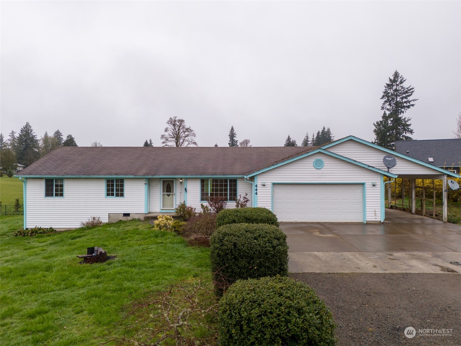 444 Bond Road Castle Rock, WA 98611 - Photo 1 of 40 a view of a yard in front of a house with plants