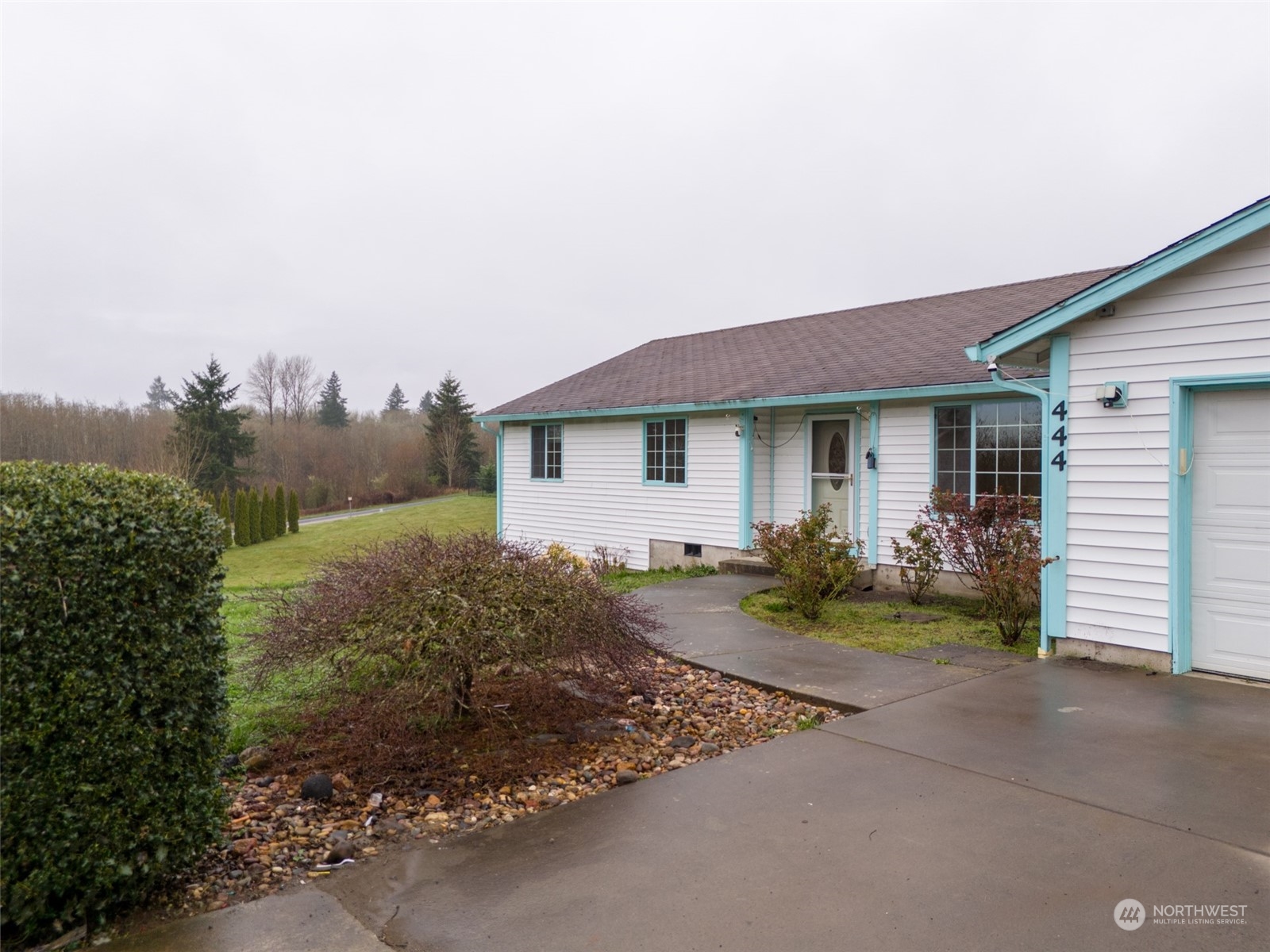 444 Bond Road Castle Rock, WA 98611 - Photo 2 of 40 a front view of a house with garden