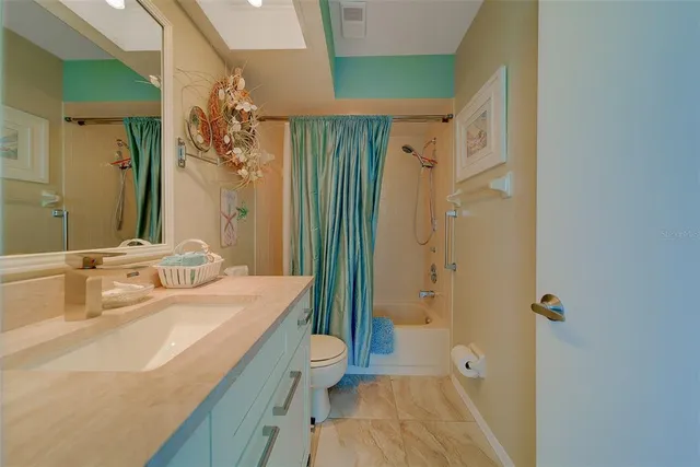 an aerial view of a house with a swimming pool yard and outdoor seating