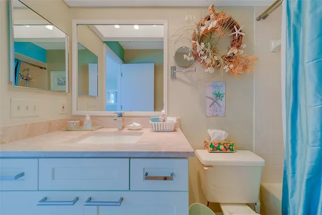 an aerial view of a house with a swimming pool