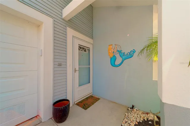 an aerial view of a house with a swimming pool