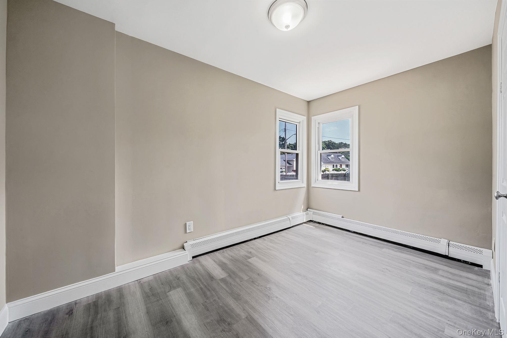 286 Old Country Road Deer Park, NY 11729 - Photo 27 of 33 an empty room with windows
