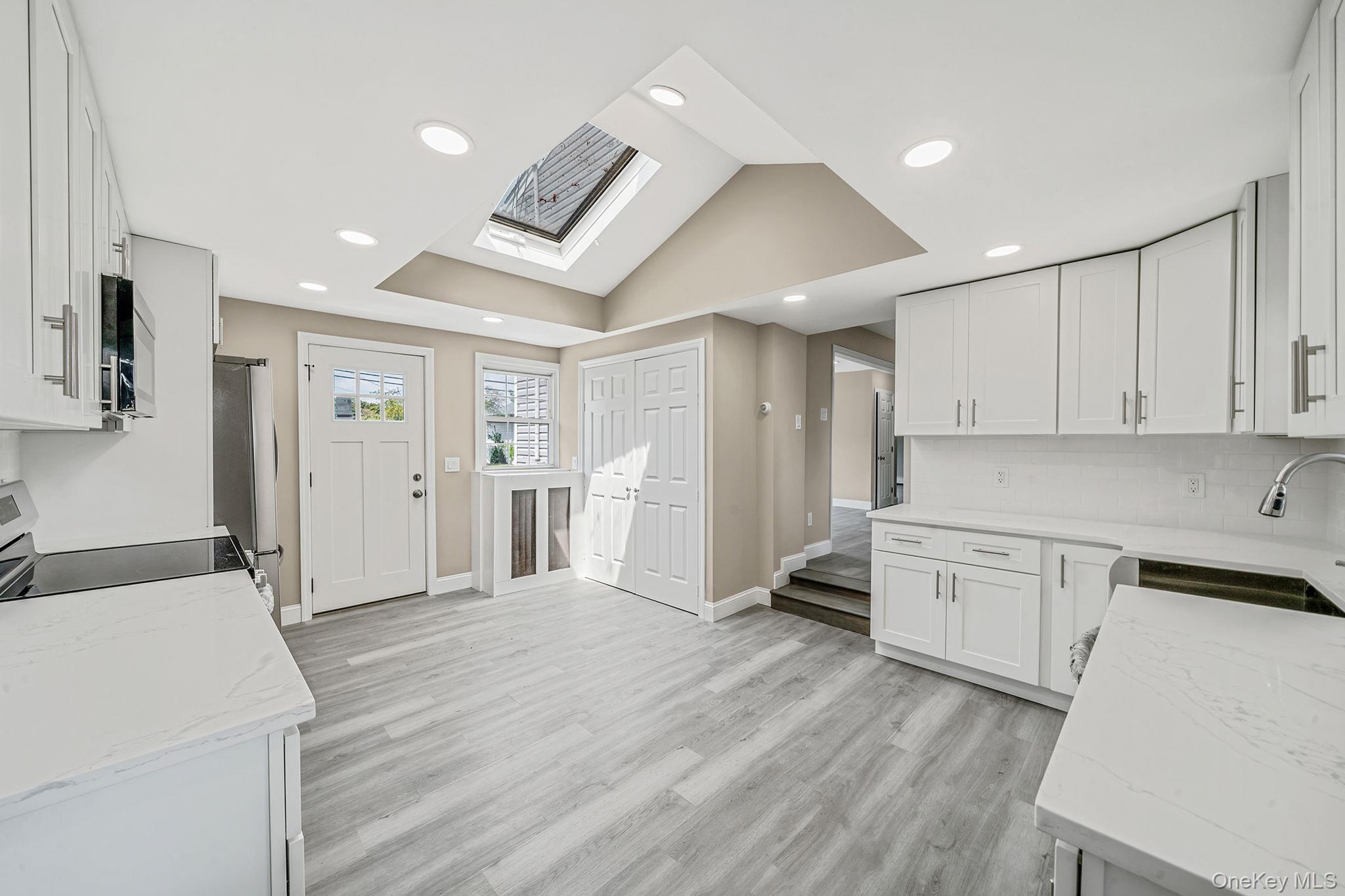 286 Old Country Road Deer Park, NY 11729 - Photo 7 of 33 a view of a kitchen with electric appliances