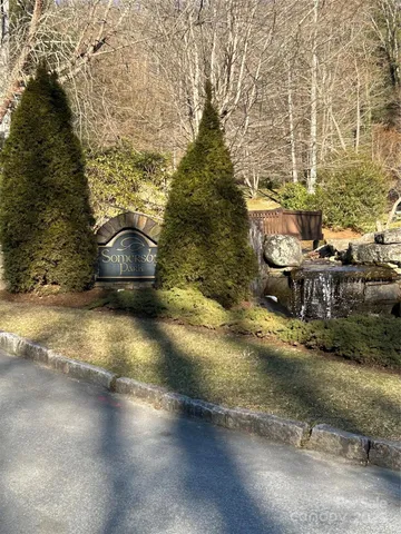 a view of a yard with a fountain