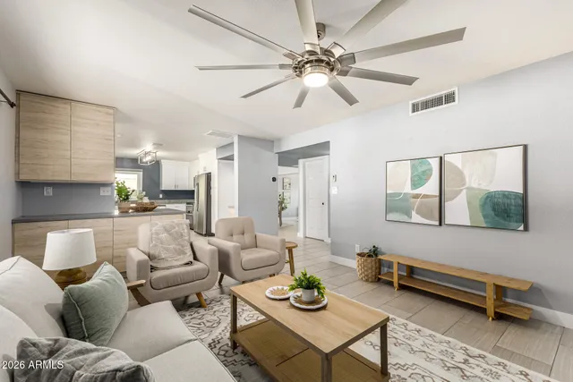a living room with furniture and a window