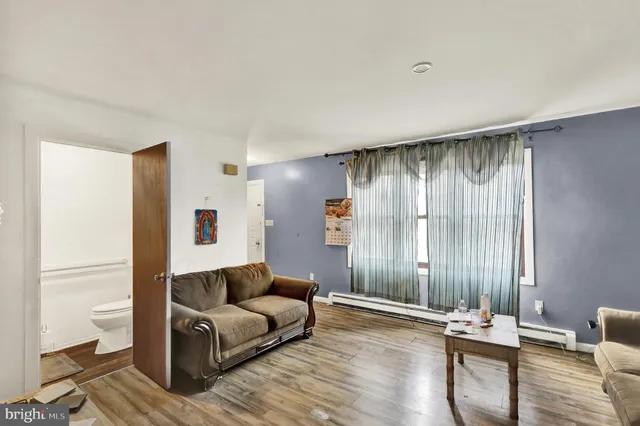 a view of a livingroom with furniture and window