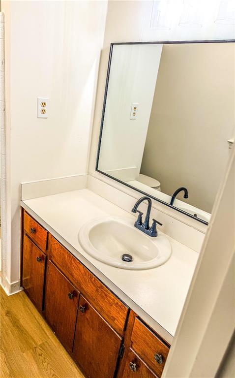 6485 Carolyn Court Rex, GA 30273 - Photo 8 of 12 a bathroom with a sink and a mirror