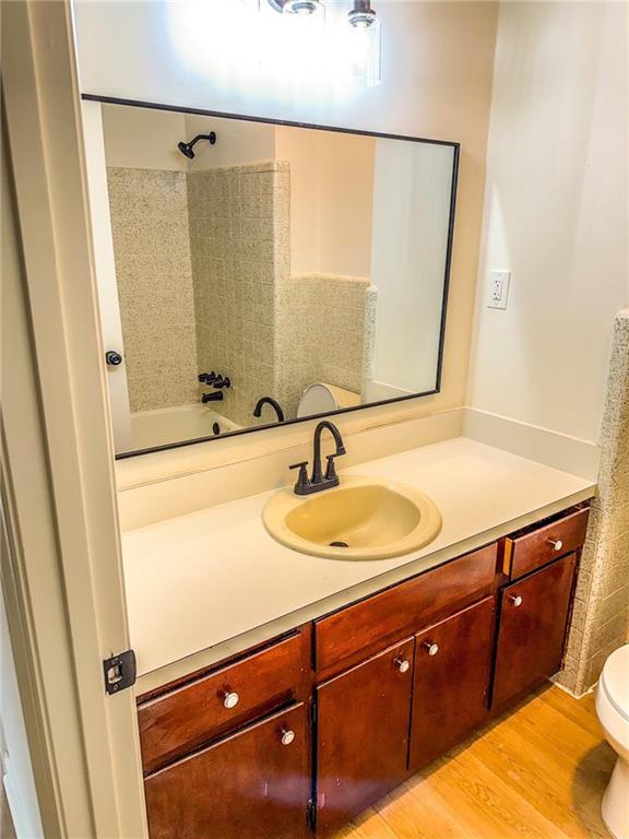 6485 Carolyn Court Rex, GA 30273 - Photo 9 of 12 a bathroom with a sink and a mirror