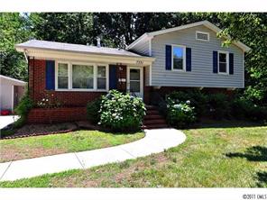 7331 Watercrest Road Charlotte, NC 28210 - Photo 1 of 16 a front view of a house with a yard and garage