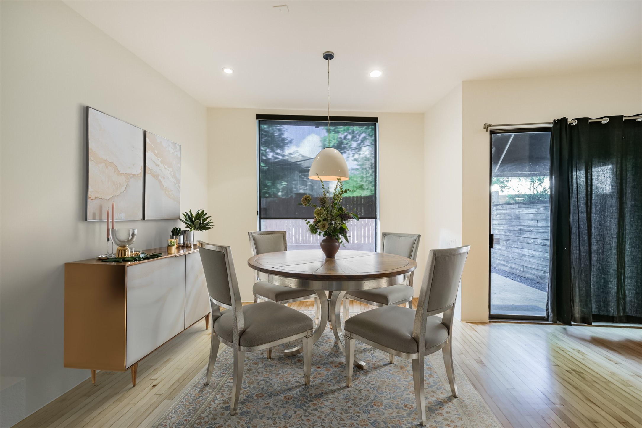 2518 Mason Street, Unit B Houston, TX 77006 - Photo 12 of 40 a dining room with furniture potted plants and wooden floor