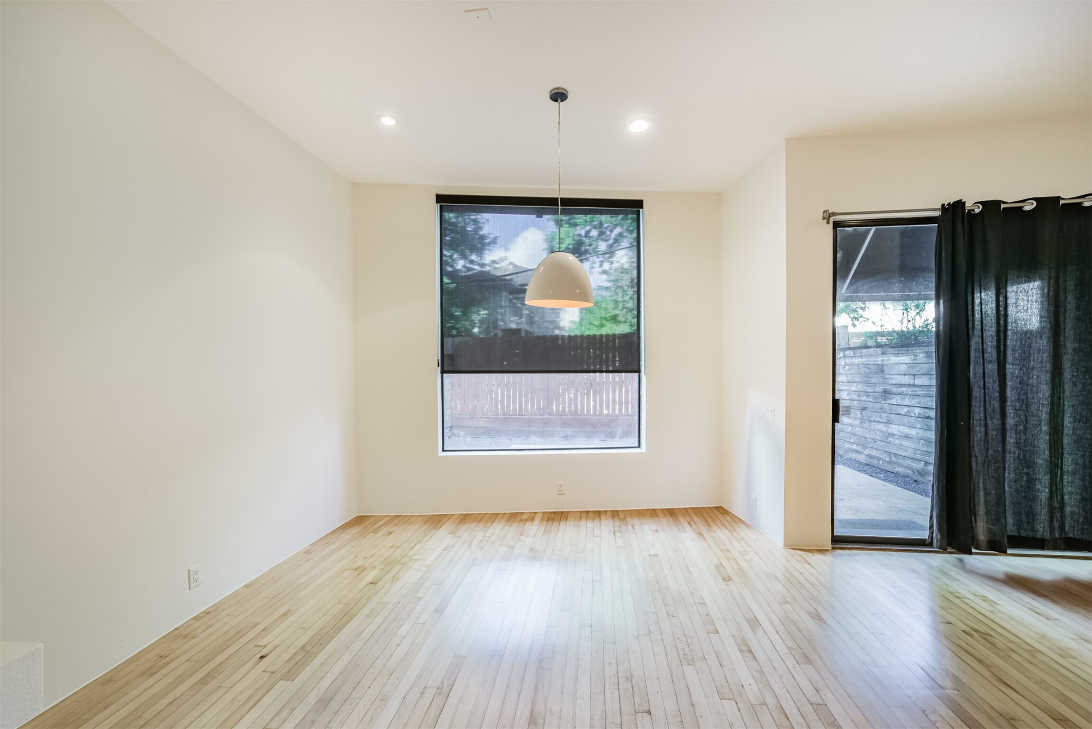 2518 Mason Street, Unit B Houston, TX 77006 - Photo 13 of 40 an empty room with wooden floor and windows