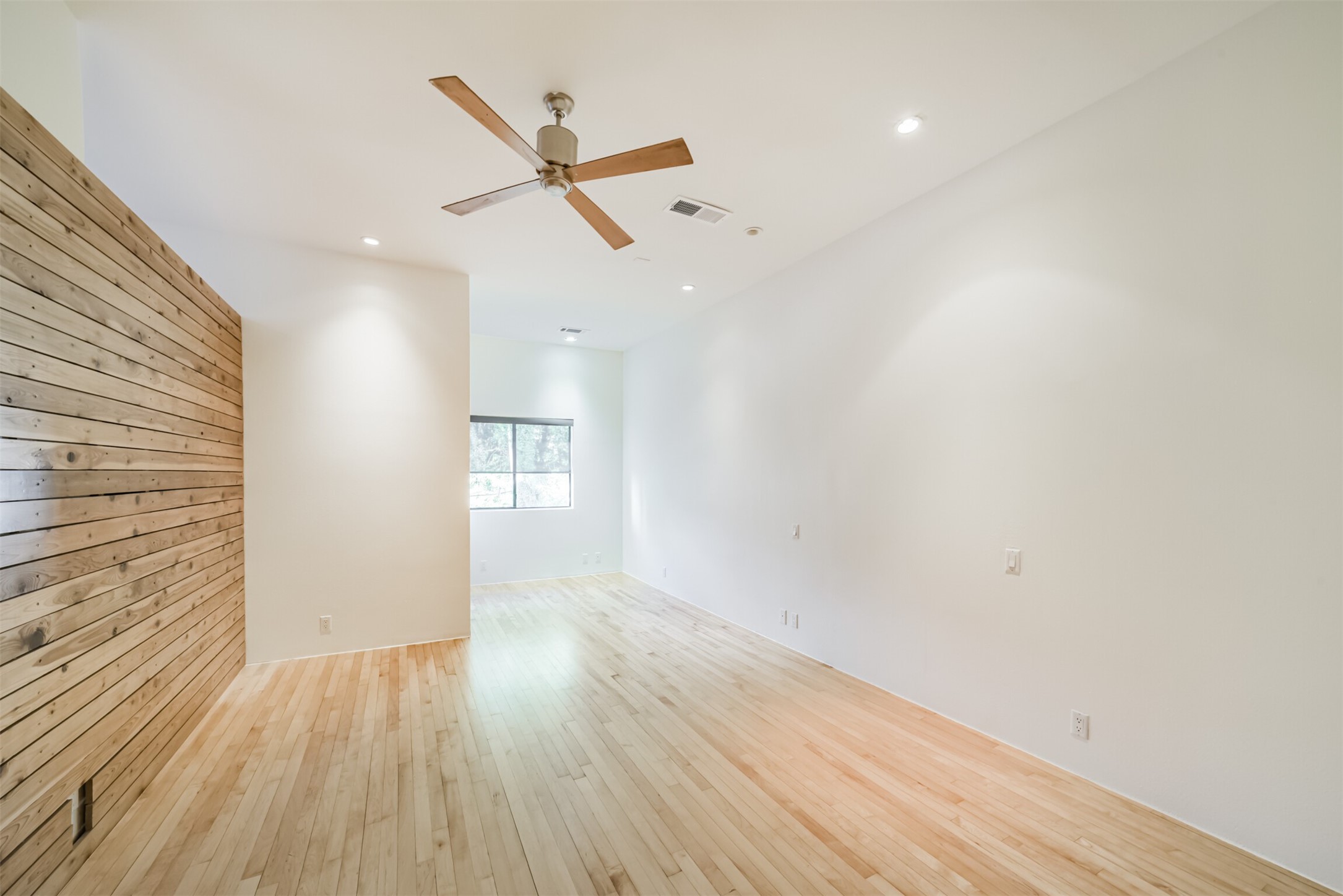 2518 Mason Street, Unit B Houston, TX 77006 - Photo 15 of 40 wooden floor in an empty room with a window