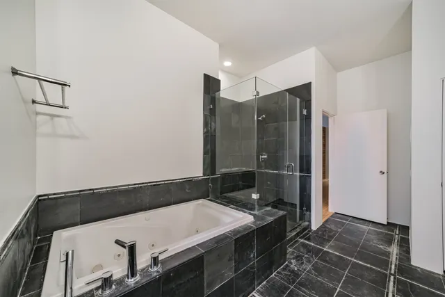 a bathroom with a double vanity sink and mirror