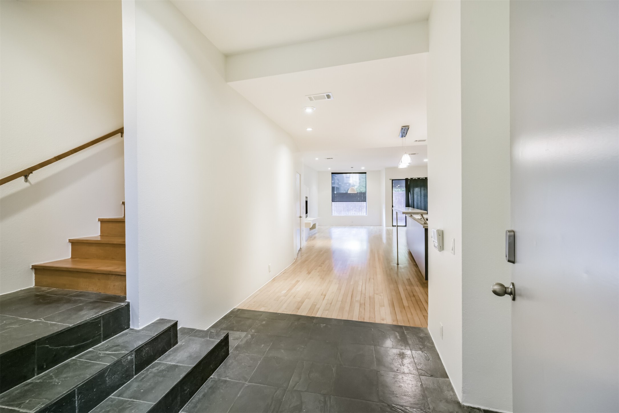 2518 Mason Street, Unit B Houston, TX 77006 - Photo 3 of 40 a view of a hallway with wooden floor and staircase