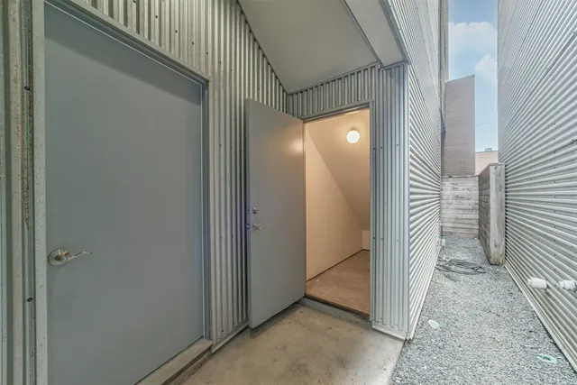 a view of a livingroom from a hallway