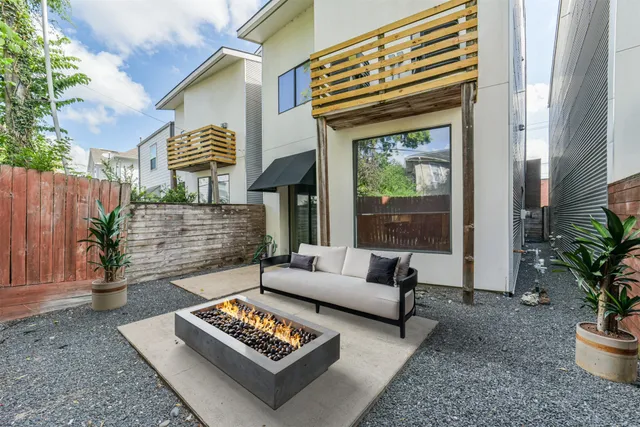 a outdoor space with patio the couches and a dining table with garden view